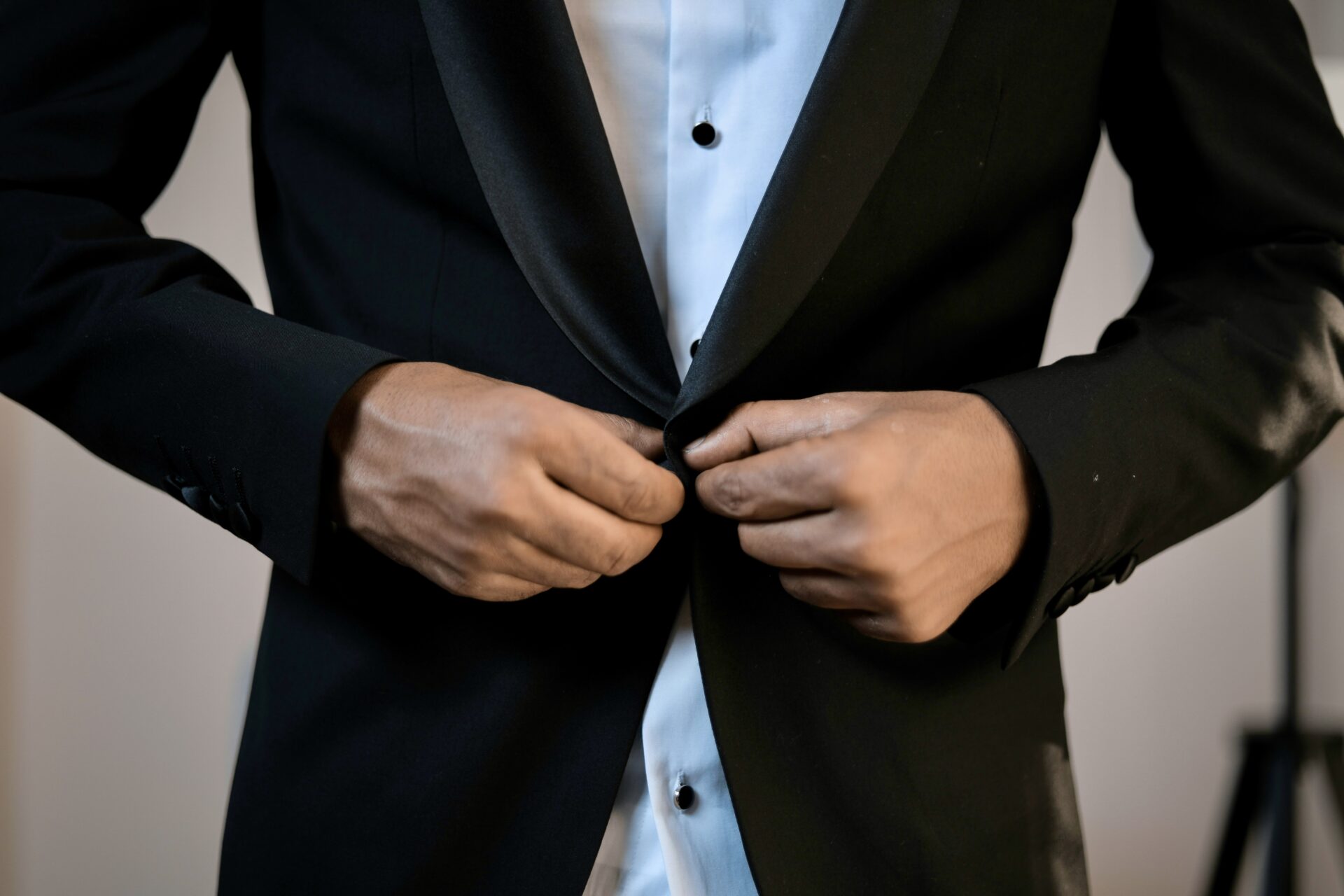 Man putting on suit