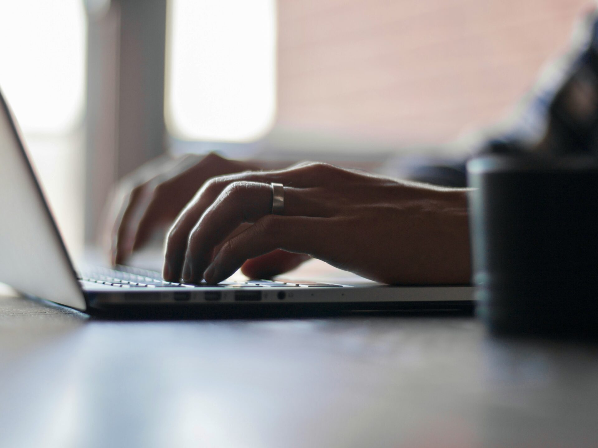 Person typing on laptop