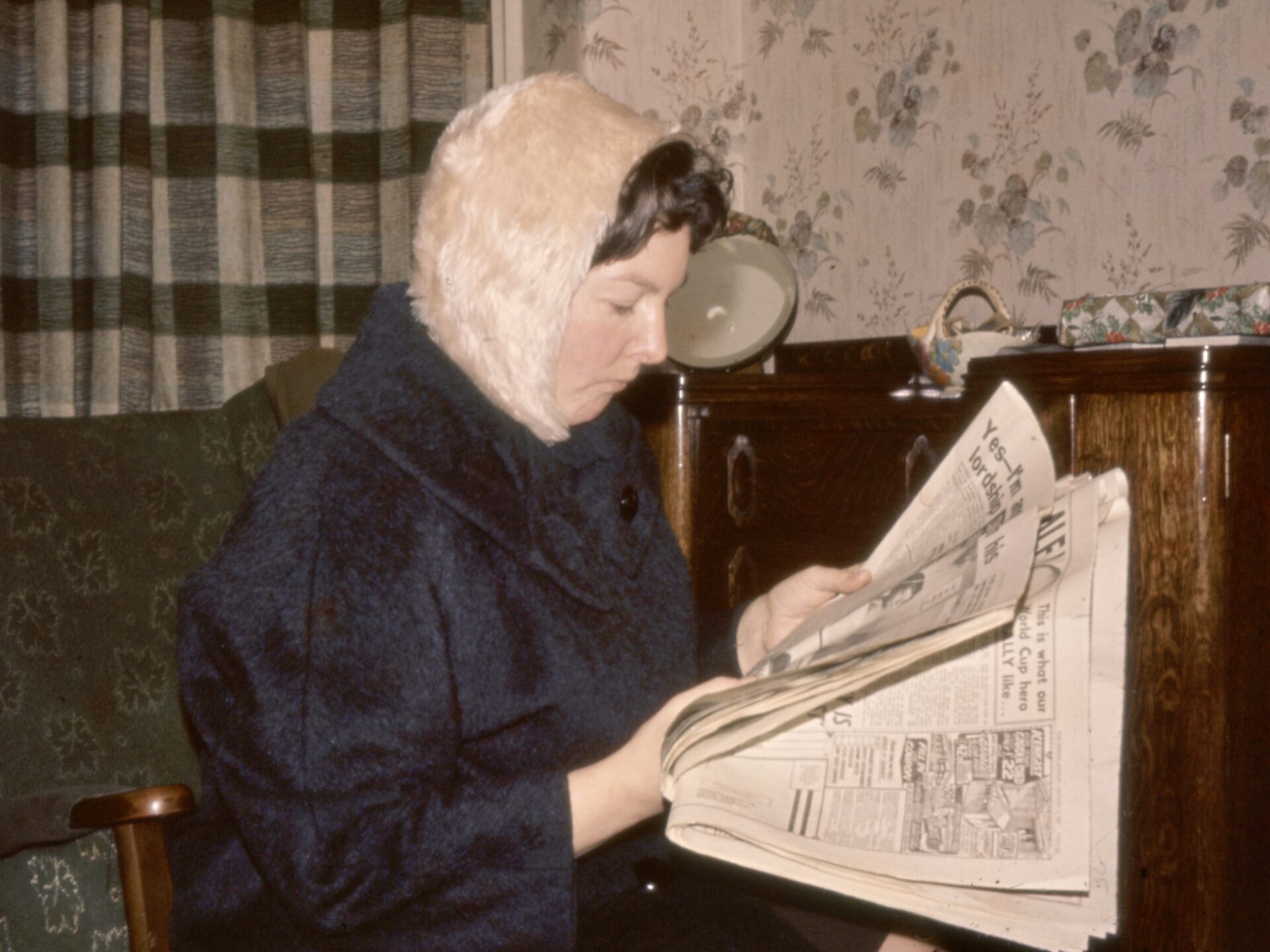 Woman reading newspaper